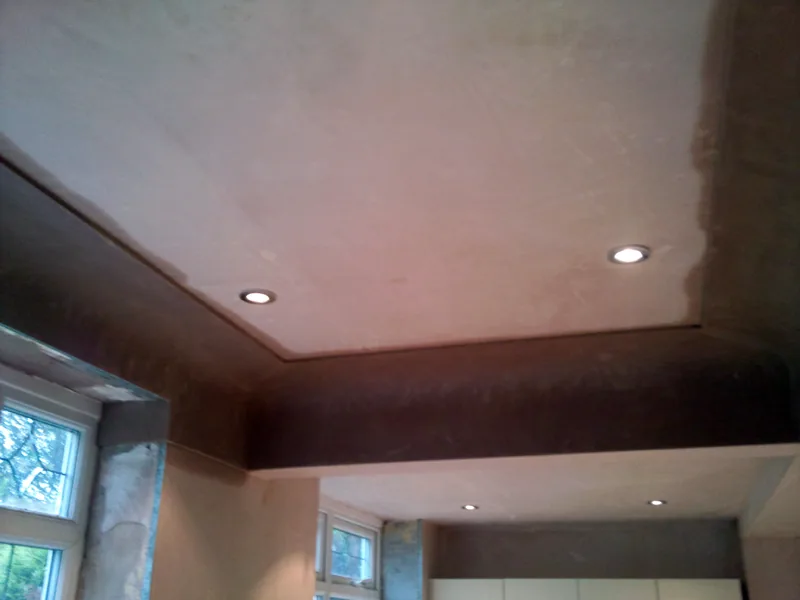 Ceilings and walls being plastered during a home refurbishment